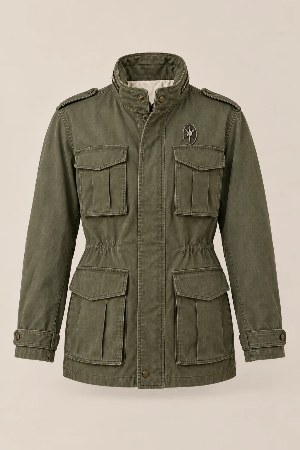 An olive M65 field jacket with four flap pockets and a small silver oval pin near the left collar, shown against pale stone.